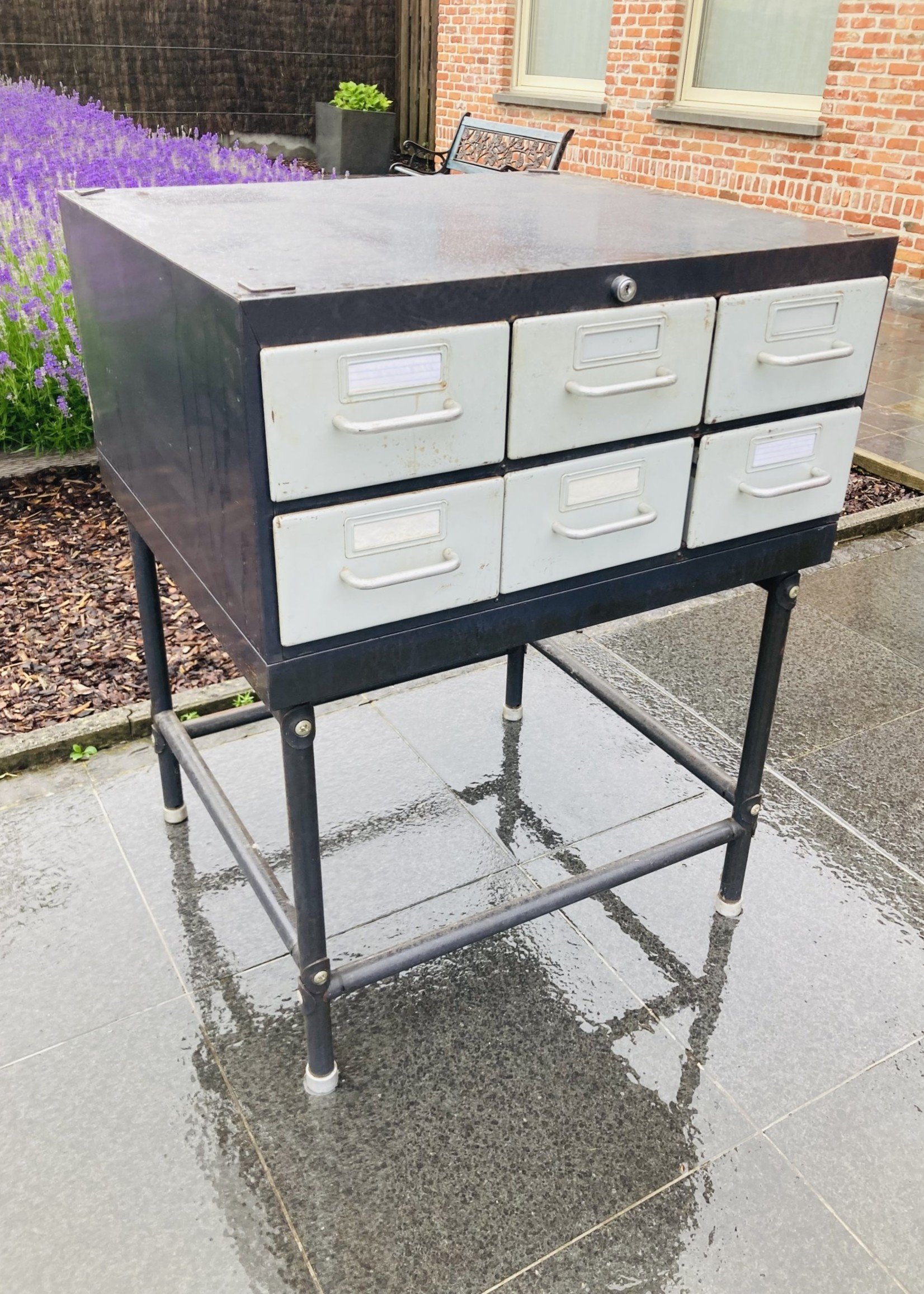 Old metal cabinet with small drawers on base (in 3 parts)