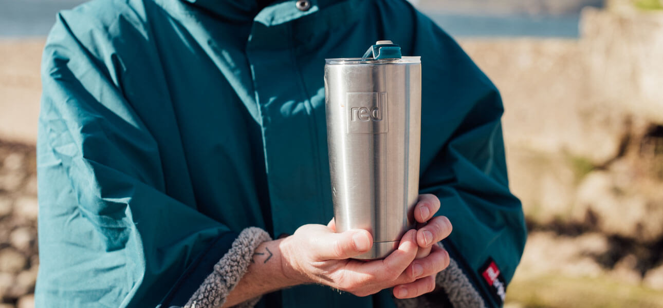 Person holding a Red Original Insulated Travel Cup