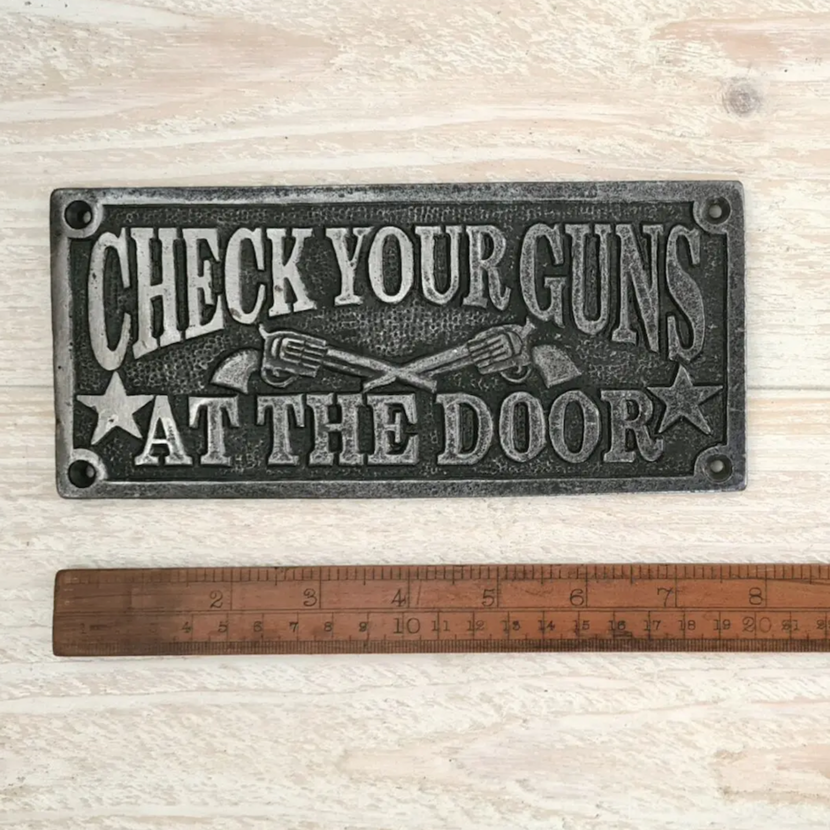 IRON RANGE Plaque CHECK YOUR GUNS Cast Ant Iron 200mm x 90mm