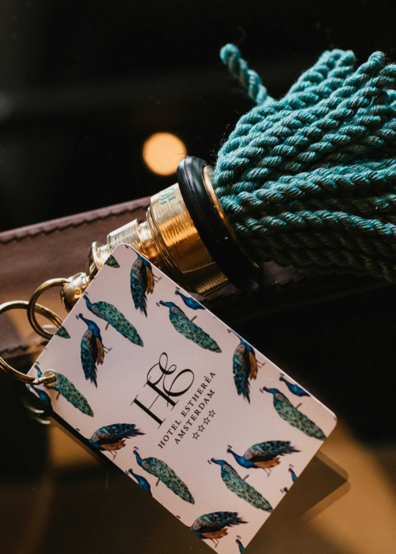 Esther's Hotel Estheréa custom keychain with blue fringe