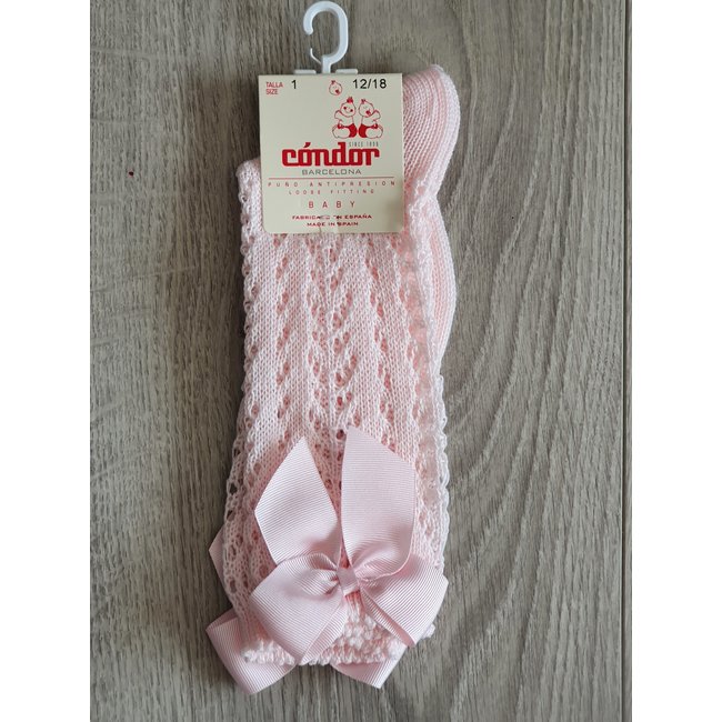 Cóndor Roze kniekous van Cóndor met visgraatpatroon en strikje.