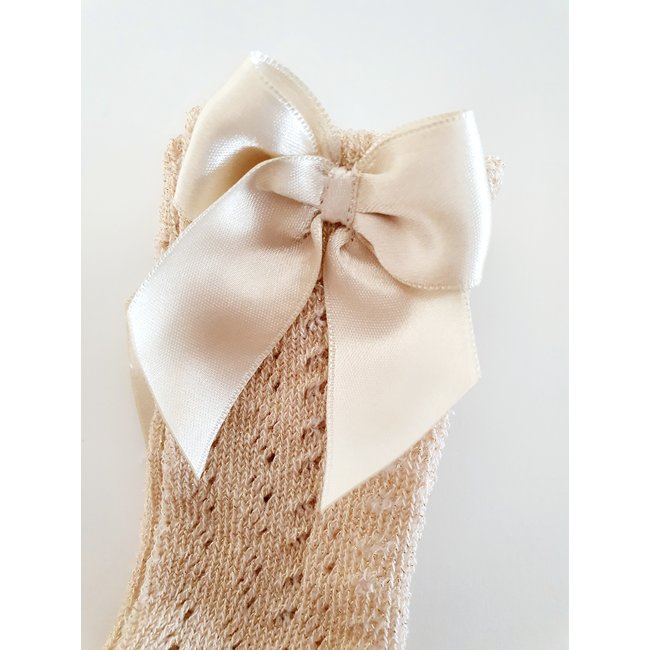 Meia Pata Gouden kniekous van Meia Pata met strik.