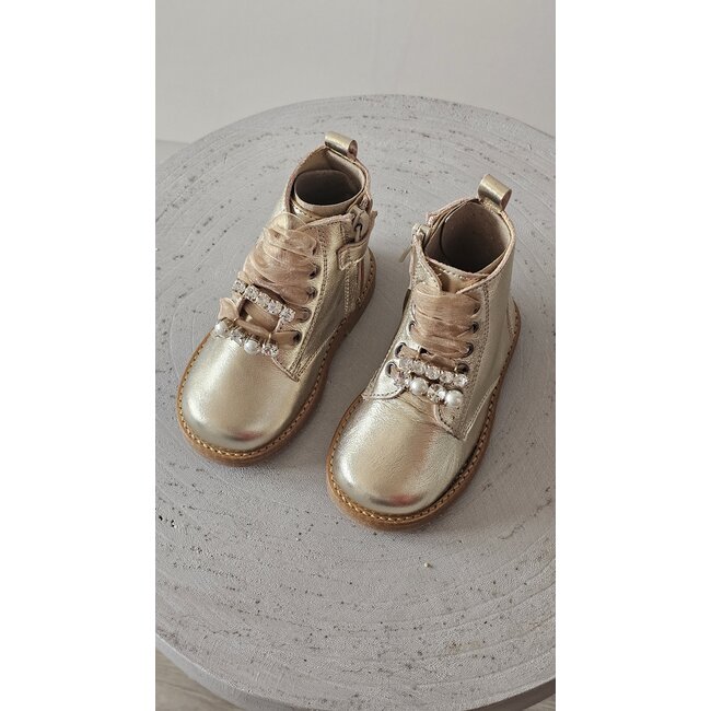 Andanines Laarsjes Amira goud