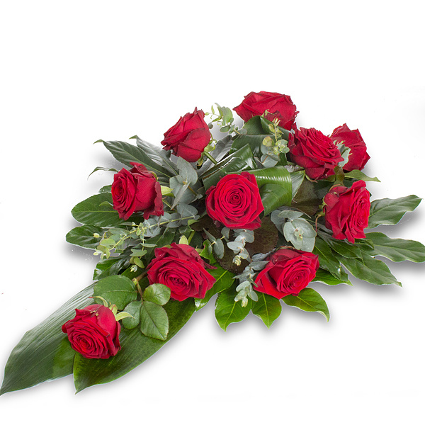 Rode rouwbloemen in een rouwbloemstuk