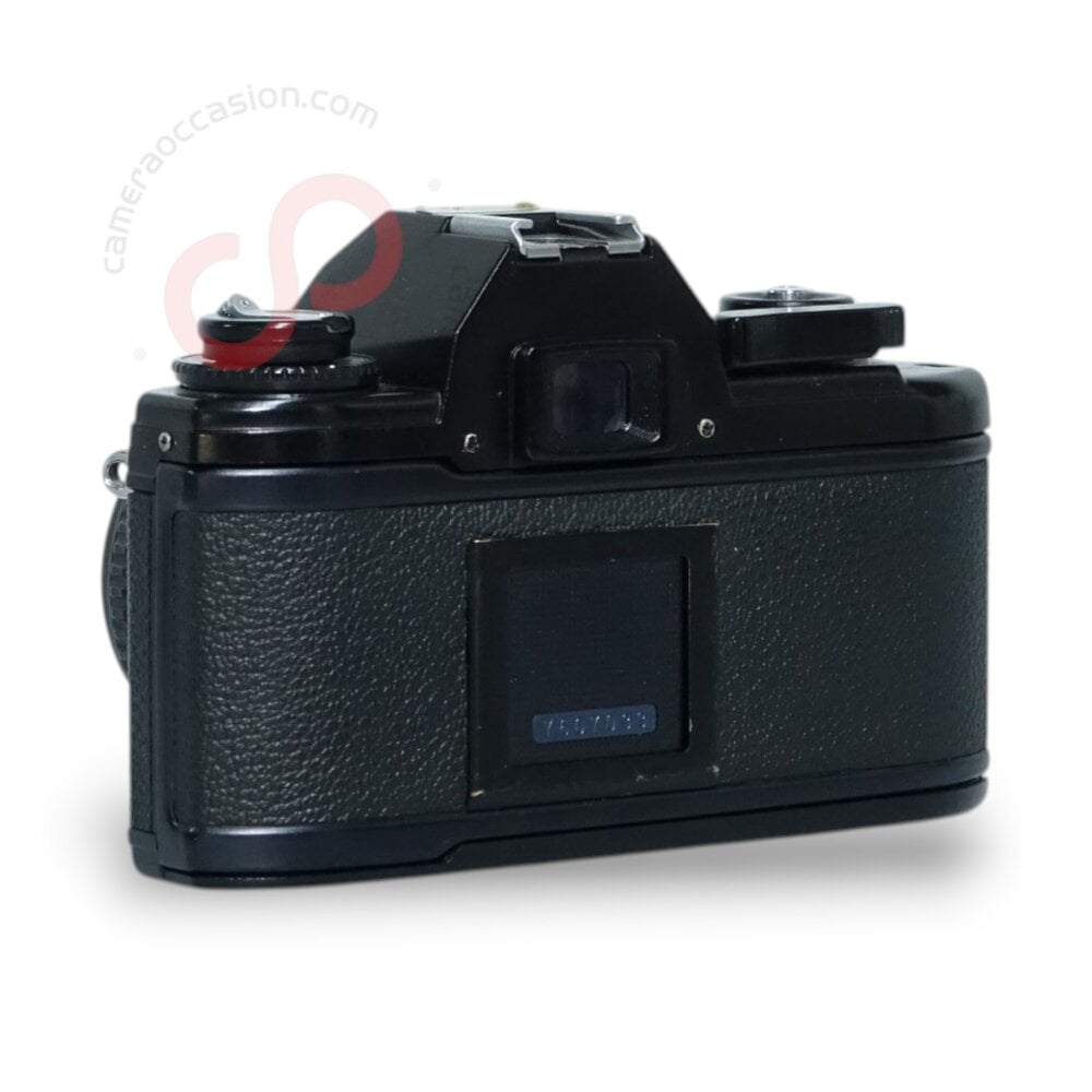 Nikon EM 35mm camera + Nikon 50mm 1.8 lens nr. 1600