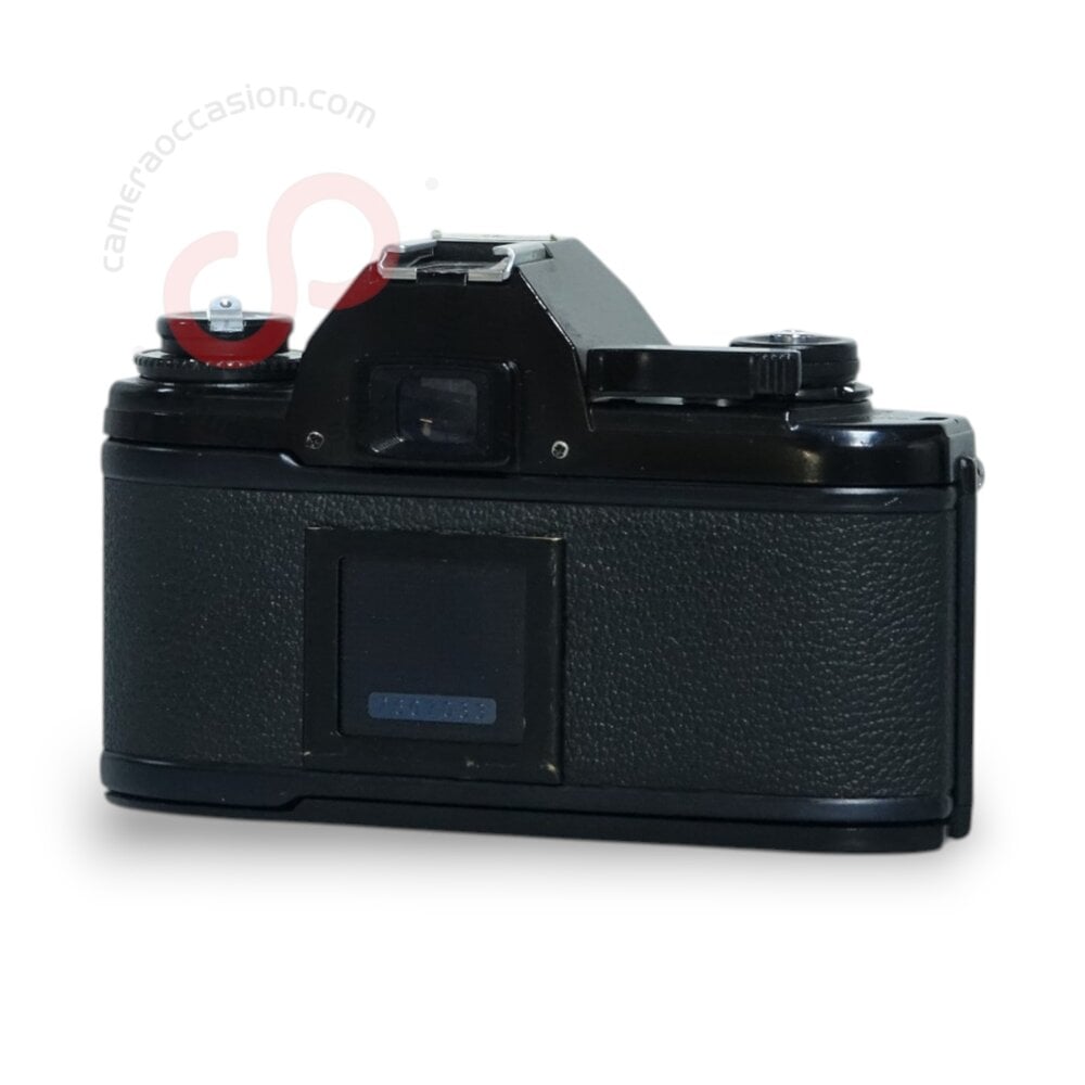 Nikon EM 35mm camera + Nikon 50mm 1.8 lens nr. 1600