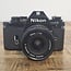 Nikon EM + 28mm 1:2.8 nr. 2369