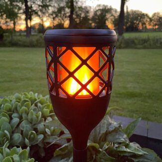 Solar table lamp with flame effect and integrated LED