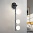 3-light wall lamp Taj with white globes - black