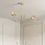Designer ceiling light Stiri gold with amber glass, 4-bulb
