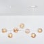 7-light pendant light Hepta - amber glass and white