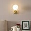 Wall light Runda - gold with milk-white glass globe
