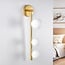 3-light wall lamp Taj with white globes - gold