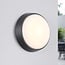 Round outdoor wall light with adjustable colour temperature - black