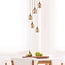 5-light designer pendant light Baton - matt black, sand gold and amber