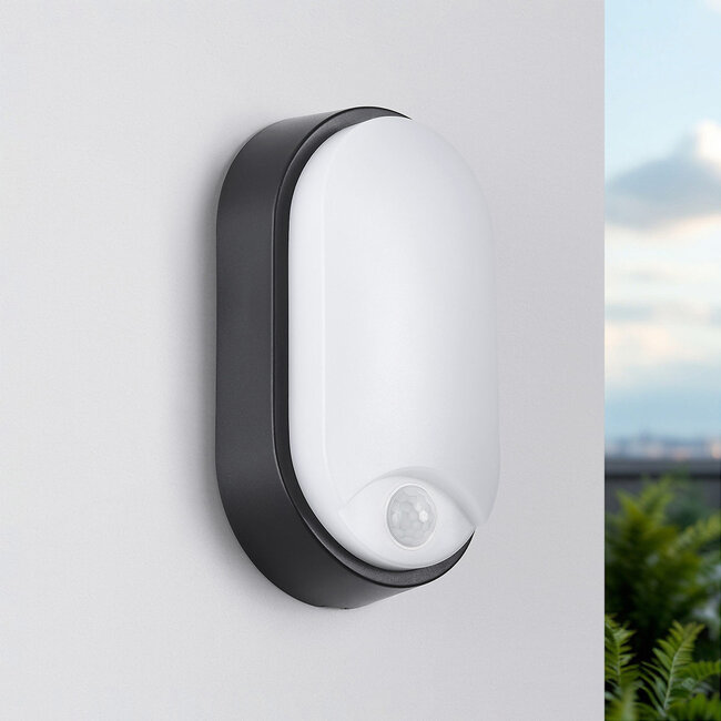 Oval outdoor wall light with sensor and three colour settings