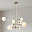 Oito 8-light ceiling light - gold with opal glass