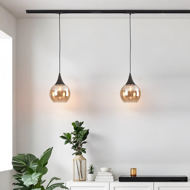 1-phase track pendant light Nya with round amber glass