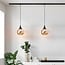 1-phase track pendant light Nya with round amber glass