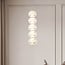 5-light pendant light Aella - white globes with gold rims and integrated LED