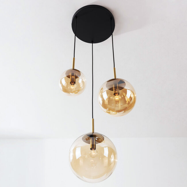 Pendant light Marui with three amber glass spheres and golden accents