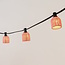 Pink Festoon lighting cable cover with rattan look