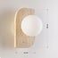 Wall lamp Artea in travertine (natural stone) with glass globe
