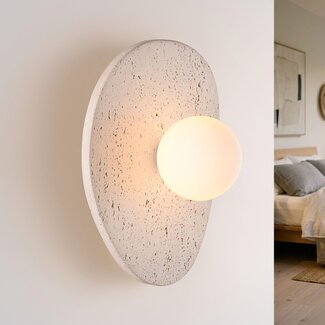 Lucio wall light in travertine (natural stone) with glass globe