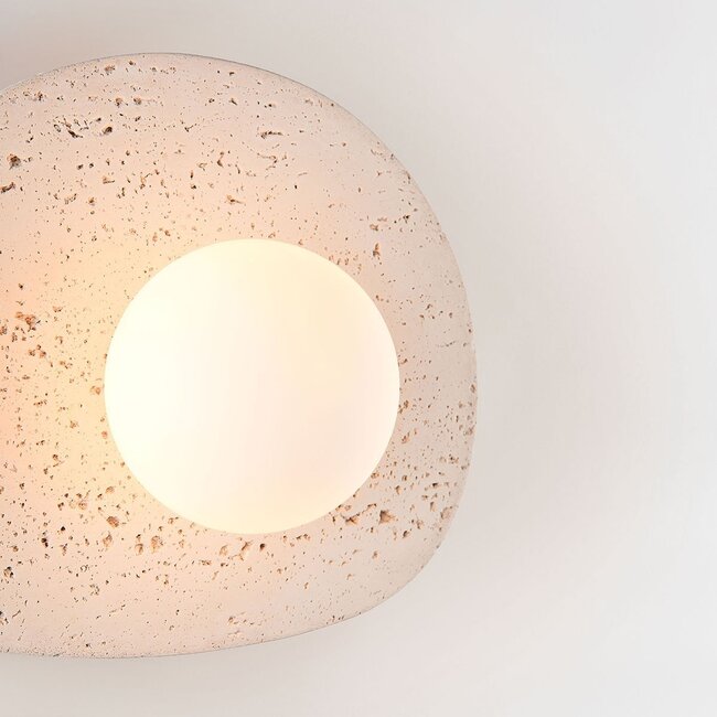 Lucio wall light in travertine (natural stone) with glass globe