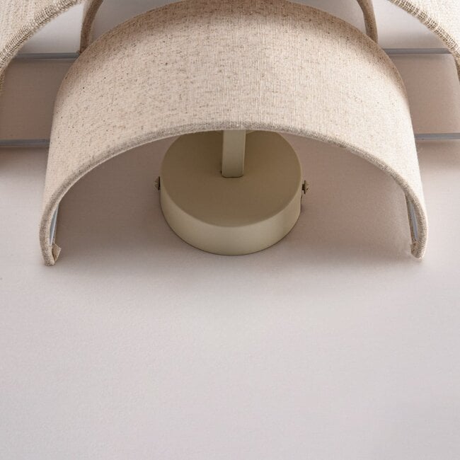 Wall light Tanja with layered fabric shade