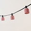 Pink festoon shade with a rattan look