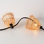 Valoketjun varjostin vaaleassa puunvärisessä rottinkilookissa