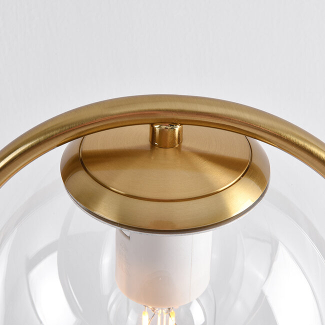Złota lampka stołowa design z przezroczystego szkła - George