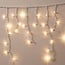 Łańcuch świetlny w formie sopli, modułowy | od 3 metrów | 114 diod LED | ciepła biel z migotaniem | biały przewód | guma