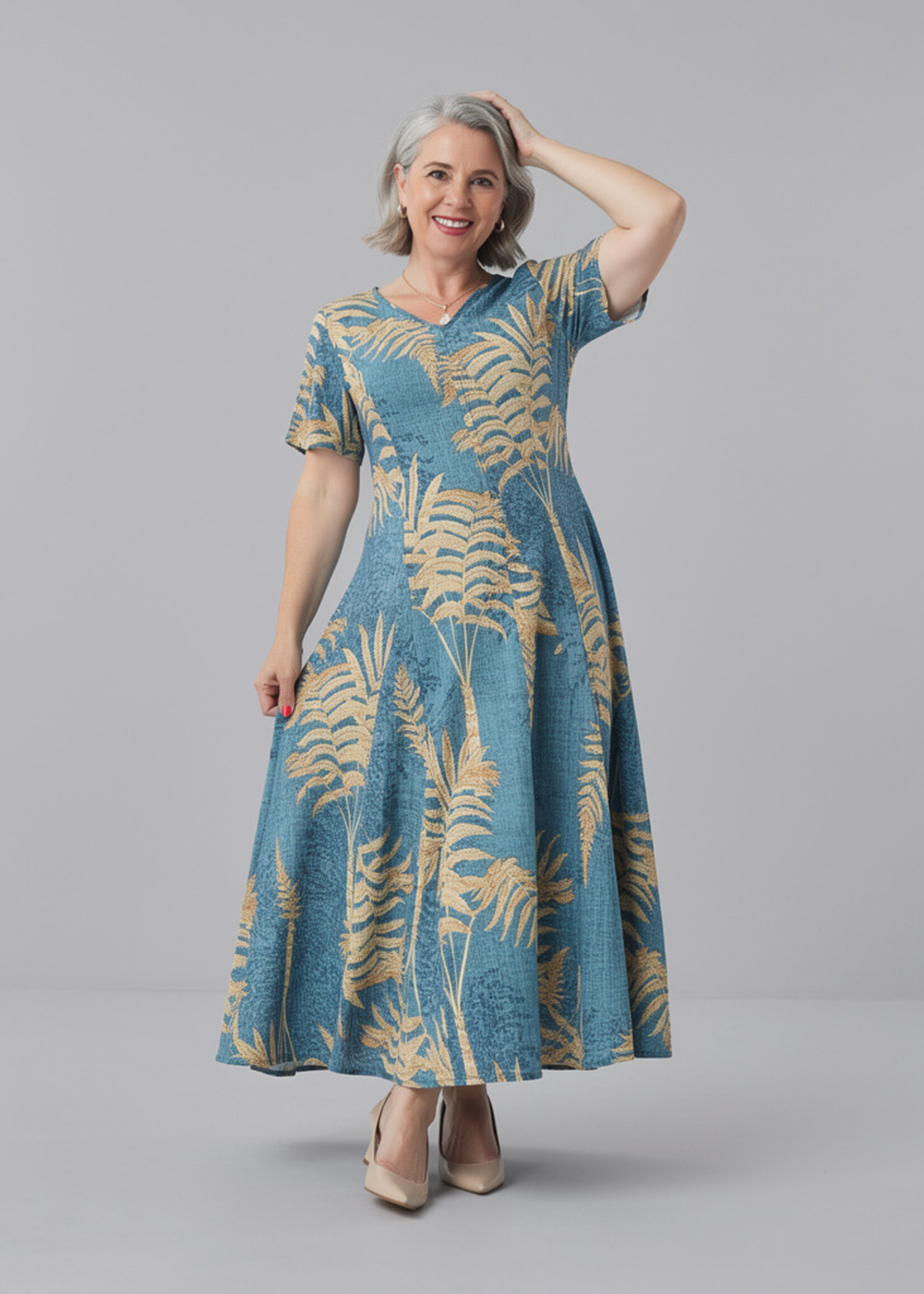 Orientique Natuurlijk, hier is de producttekst voor de Orientique Jurk Ponta Verde Godet (40203).  Op basis van de foto zie ik een prachtige, diepe blauw-groene (petrol/teal) basiskleur met een beige/goudkleurige palmbladerenprint. Het is duidelijk weer het geliefde