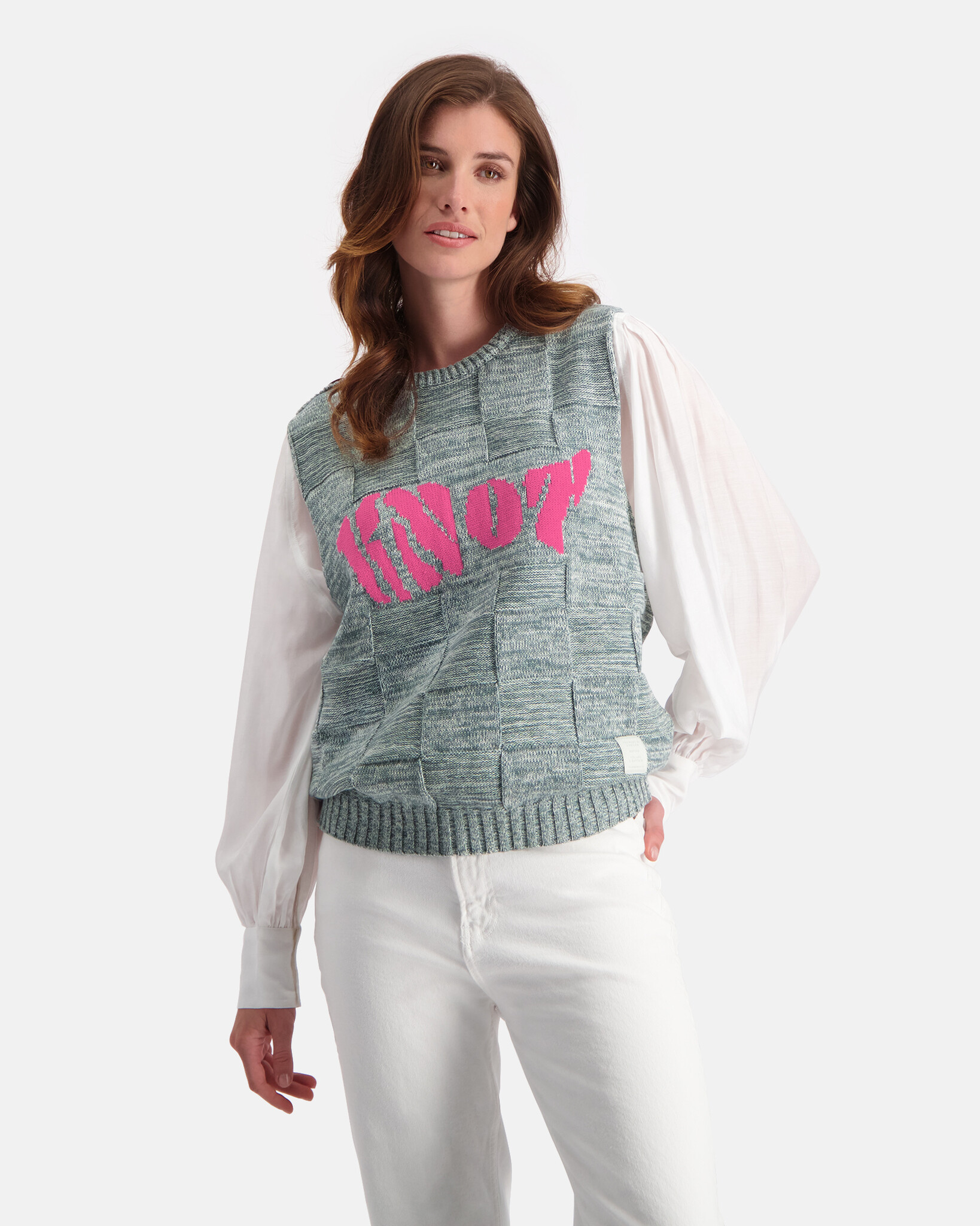 Structure knitted spencer with intarsia artwork and shoulder buttons