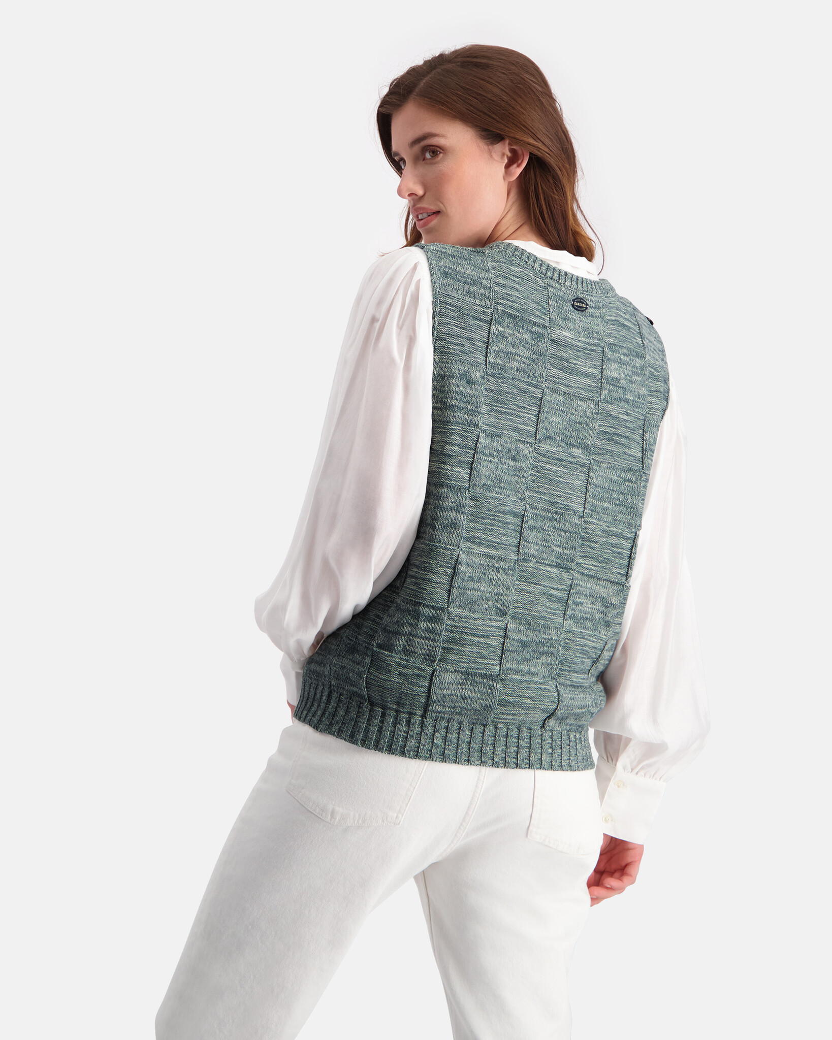 Structure knitted spencer with intarsia artwork and shoulder buttons