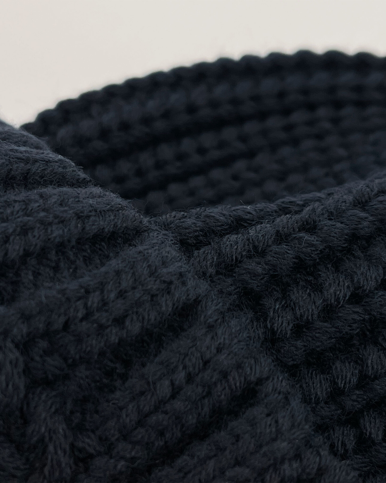 Heavy knitted beanie made from sustainable Polylana® fiber mix with trademark logo