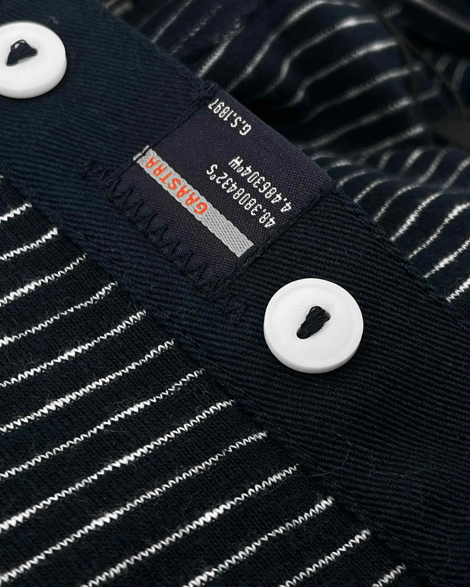 Slub yarn striped henley with small embroidered trademark logo on chest