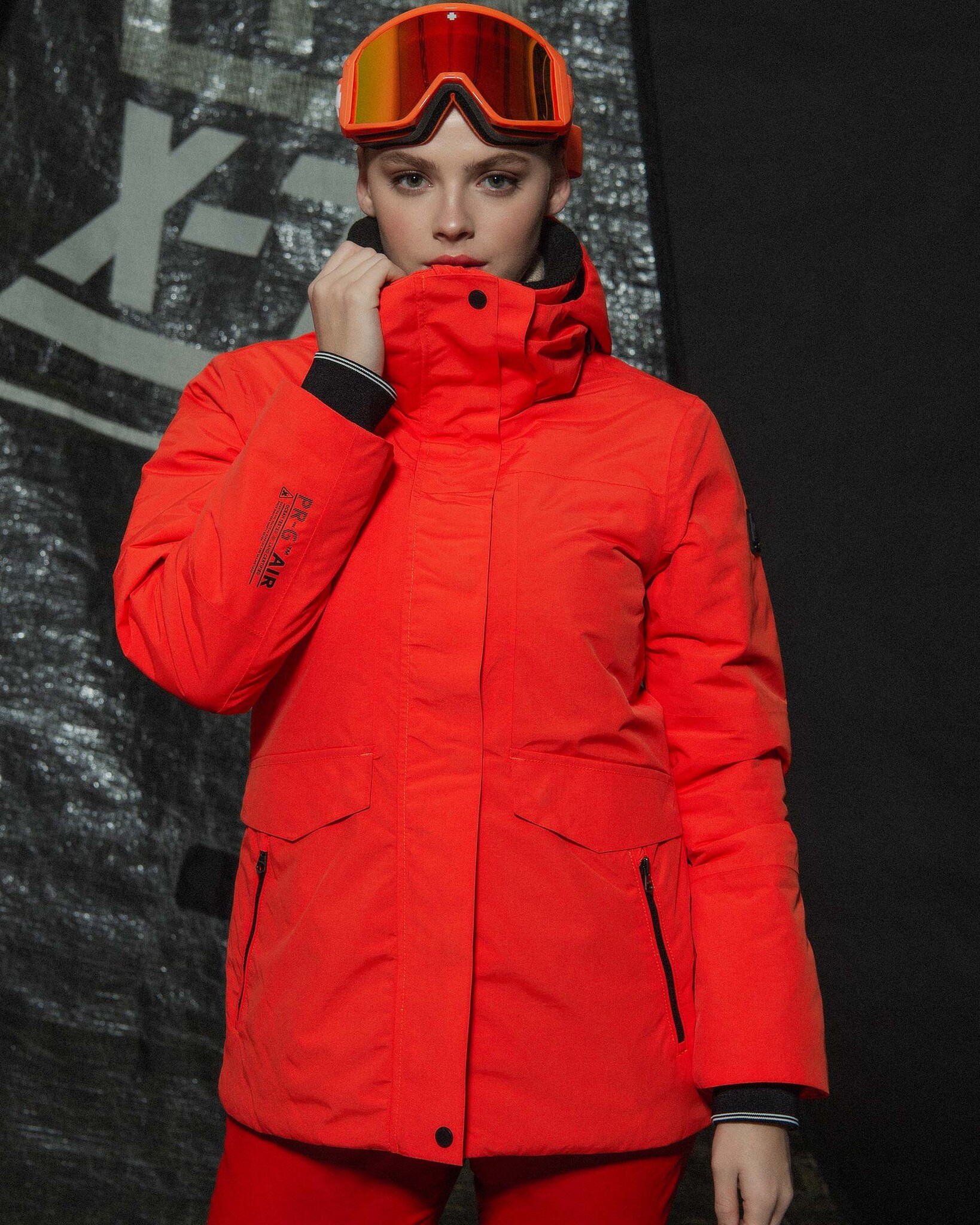 Waterproof Mid Length Jacket  developed with a technical 2-layer fabric, detachable hood and REPREVE® padding