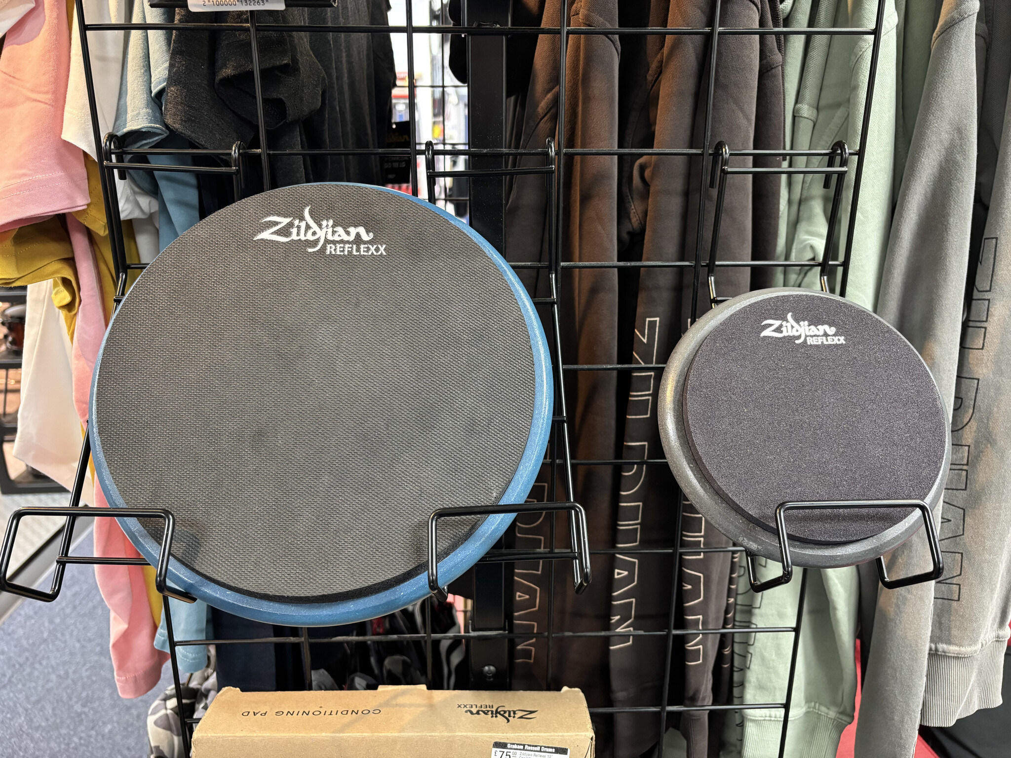 Blue 10-inch and black 6-inch Zildjian Reflexx Conditioning Pads on display at Graham Russell Drums