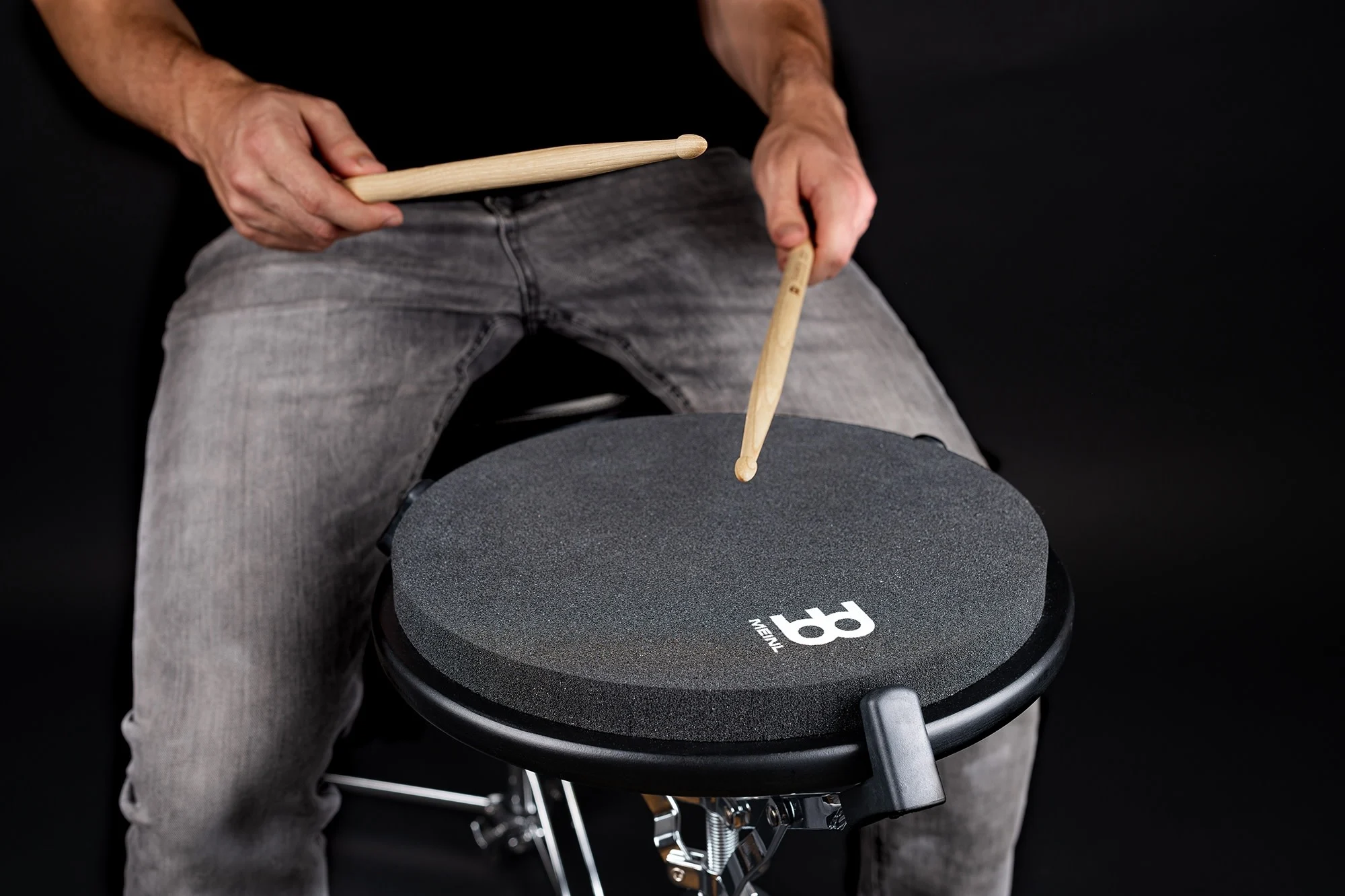 Black Meinl 12-inch Marshmallow Practice Pad set up in a snare drum stand