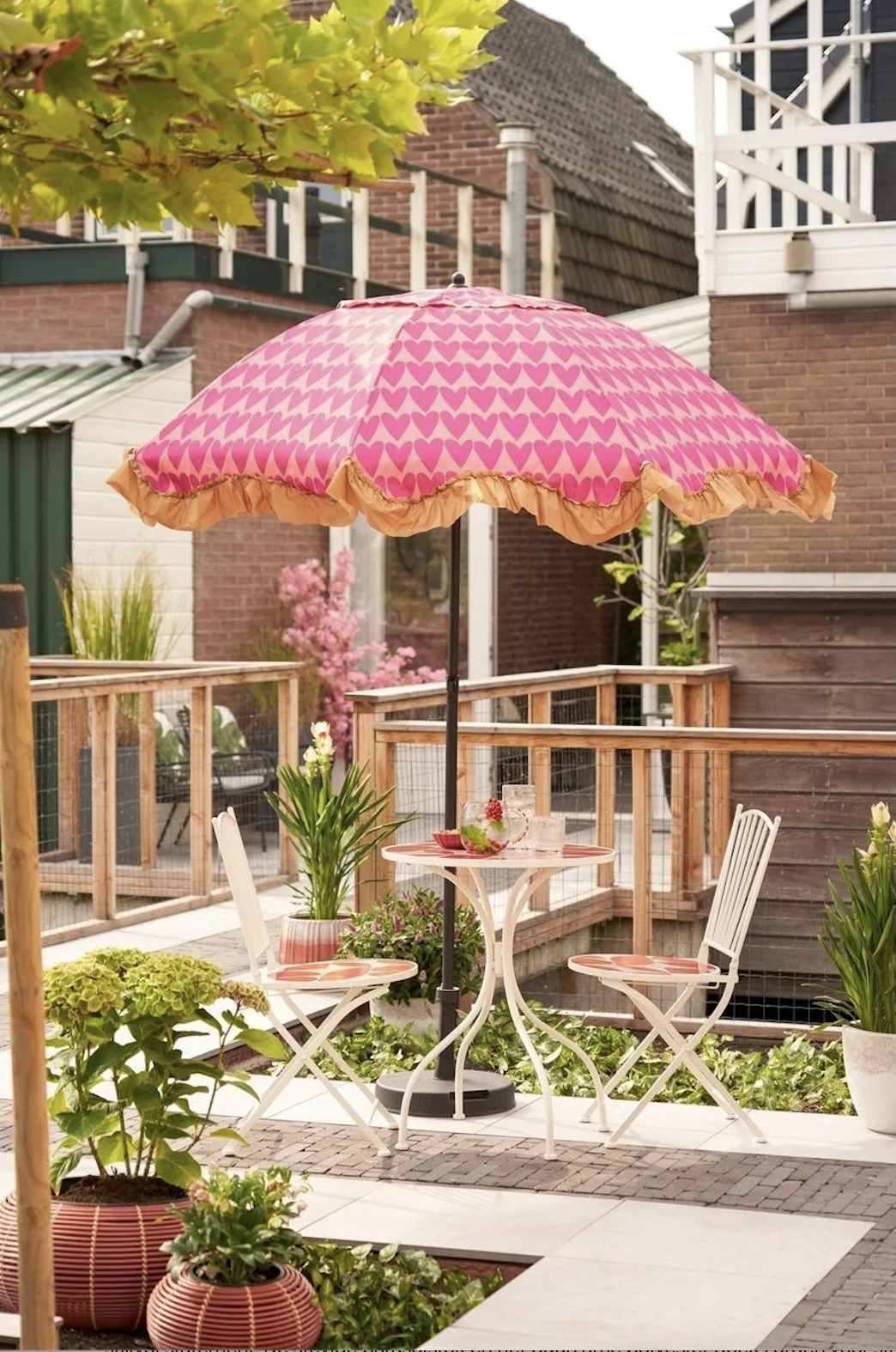 Parasol roze met hartjesprint en ruches