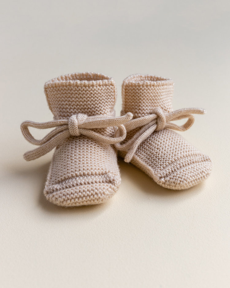 Hvid babyslofjes van merinowol oat