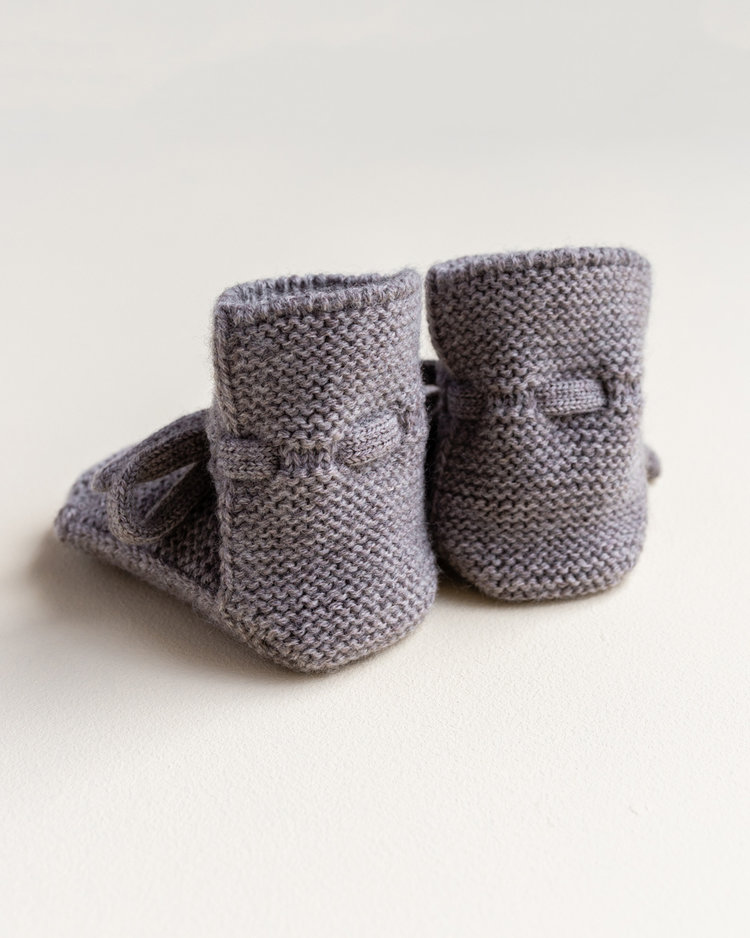 Hvid babyslofjes van merinowol otter