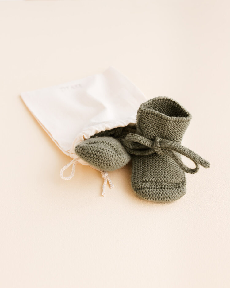 Hvid babyslofjes van merinowol groen