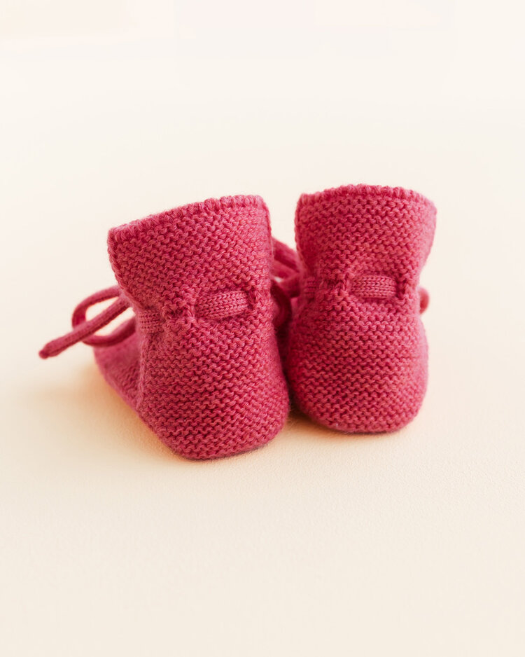Hvid babyslofjes van merinowol roze