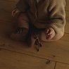 Hvid babyslofjes van merinowol donkerbruin Hvid babyslofjes van merinowol donkerbruin