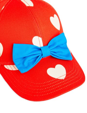 Mini Rodini Hearts aop bow cap red Mini Rodini Hearts aop bow cap red