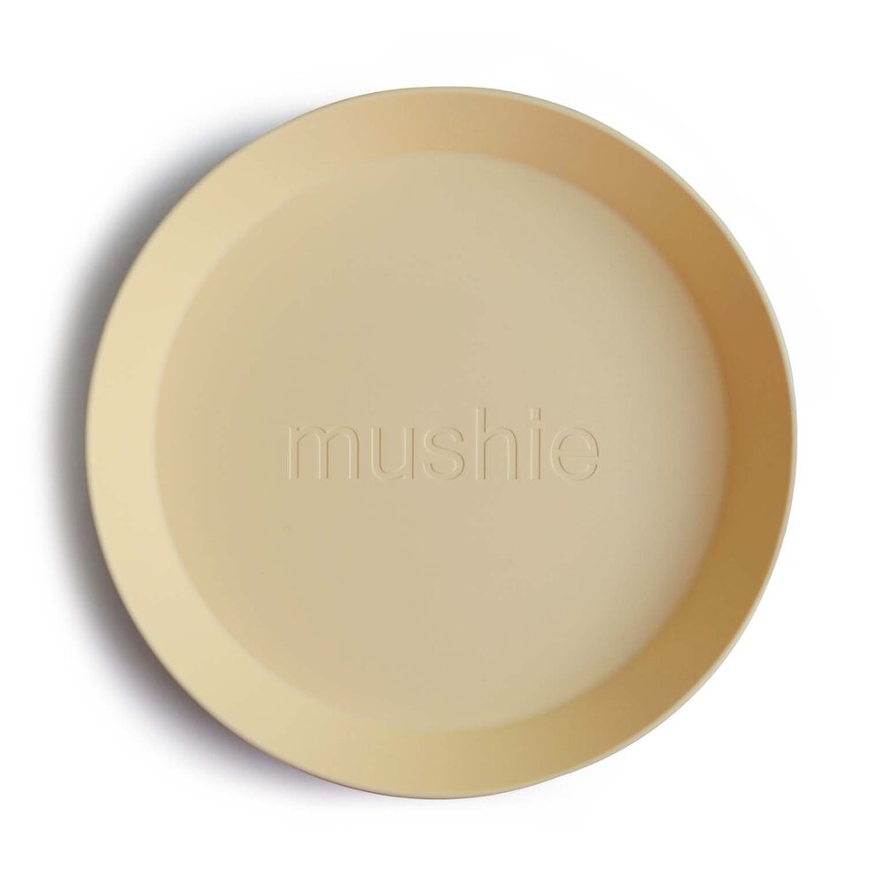 Mushie Set of 2 round plates  - pale daffodil